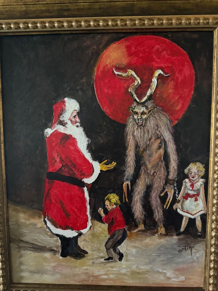 Painting of Krampus beside Santa with children, from the Krampus art collection at Krush Brau Park